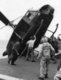 Vietnam / USA: Operation Frequent Wind, April 1975 - A surplus helicopter is unceremoniously tipped over the side of a US Navy carrier to make way for further evauation aircraft