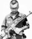 Vietnam: Captain Michael Harvey, US Army MP, inspects a captured National Liberation Front (Viet Cong) AK-47, 1968